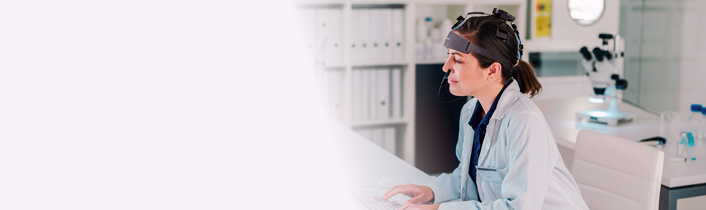 Woman researcher wearing Vielight Neuro headset in laboratory setting